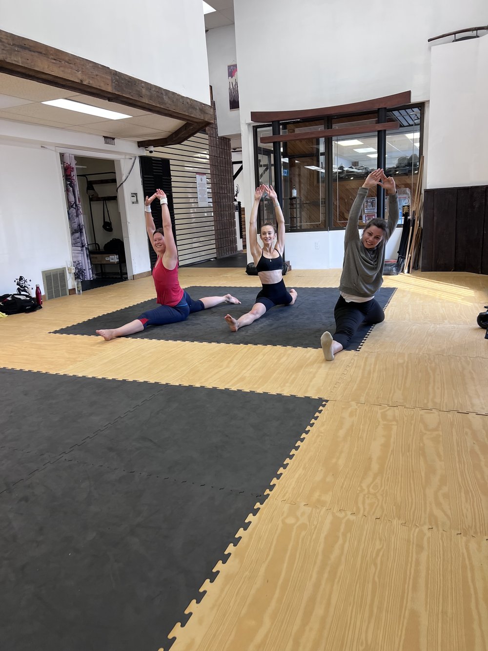 Women's class members celebrating after a workout